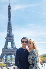 Couple man and woman near the eiffel tower. Selective focus.