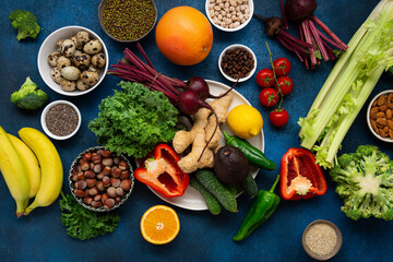 Overhead view of plate with fresh vegetables ready for cooking
