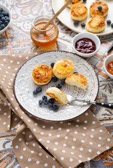 Breakfast cheese pancakes with berries and jam