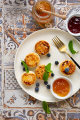 Breakfast cottage cheese pancakes with berries and jams