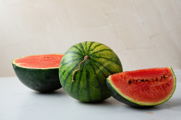 One whole green watermelon and sliced summer concept