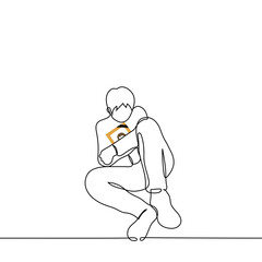 man mourns for a deceased loved one - one line drawing vector. a man sits hugging a photo in a wooden frame with a black stripe. concept sorrow, grief and sense of loss