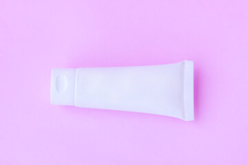 Cosmetic bottle on pink background