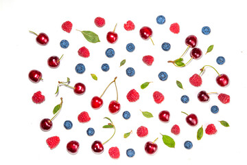 Mix of isolate blueberry, blackberry, raspberry, cherry and mint. Fresh ripe berry set isolated on white background