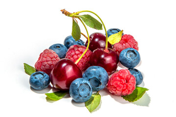 Mix of isolate blueberry, blackberry, raspberry, cherry and mint. Fresh ripe berry set isolated on white background