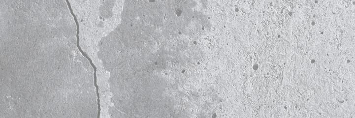 Texture of old cracked concrete wall. Rough gray concrete surface. Wide panoramic background for design.
