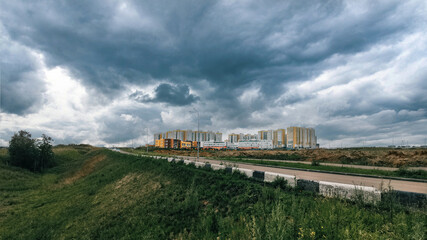 Fototapeta premium landscape view of the city on a cloudy summer day