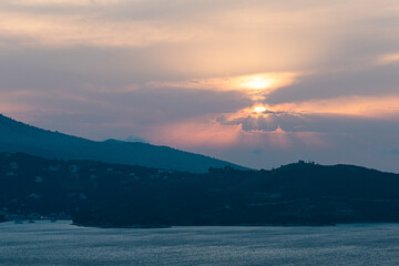 Fototapeta premium Ksamil, Albania The view over towrds Corfu, Greece and the Ionian islands at sunset