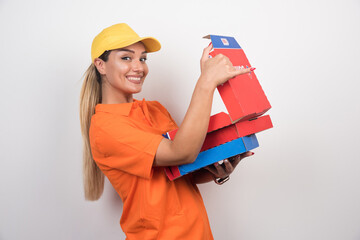 Pizza delivery woman opening pizza box with happy face on white background