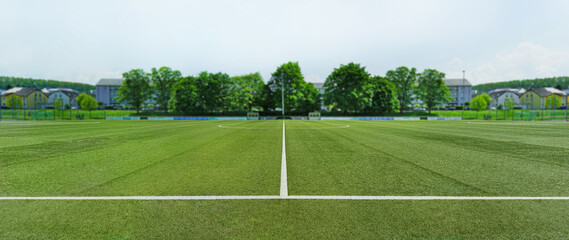 textured soccer game field in a small town. - center, midfield