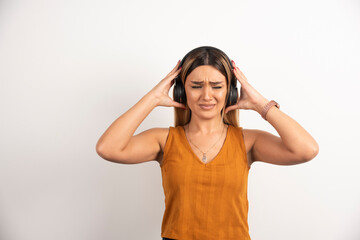 Young woman girl in casual clothes posing with headphones