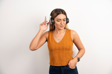 Young woman girl in casual clothes posing with headphones