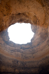 Round hole in rocky benagil cave