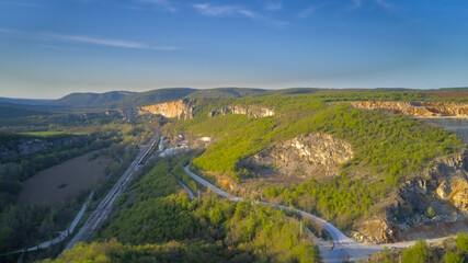 Fototapeta na wymiar Aerial photography from a drone. View of a mining quarry aerial view at sunset