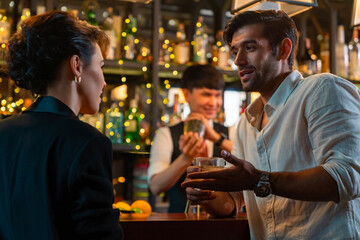 Caucasian man and woman flirting each other while hangout nightlife party at restaurant bar. Attractive female have romantic dating with boyfriend celebrating holiday event together at nightclub