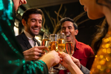 Group of Diversity people celebrating and toasting champagne glass together at luxury restaurant bar. Happy man and woman friends enjoy and fun holiday hangout party meeting nightlife at nightclub