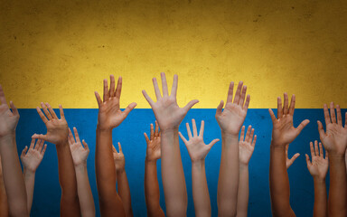 fight, freedom and national concept - hands of international people group over flag of ukraine on background © Syda Productions