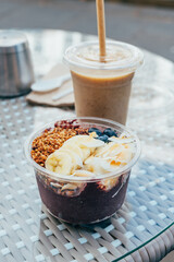 Acai Bowl with base made of wild acai berry, banana, medjoul dates, almond butter. Standard toppings: sliced banana, fresh blueberries, coconut chips and homemade gluten free buckwheat granola