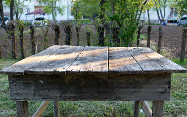 an old, worn garden table at the garden