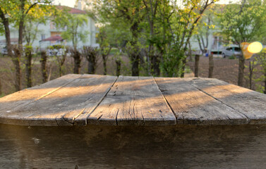 an old, worn garden table at the garden