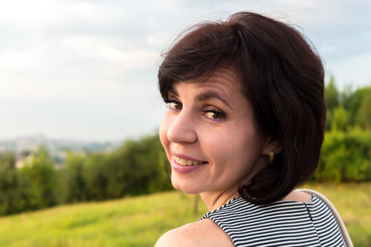 Close-up Portrait Woman 40-44 Years Old With Short Black Hair.