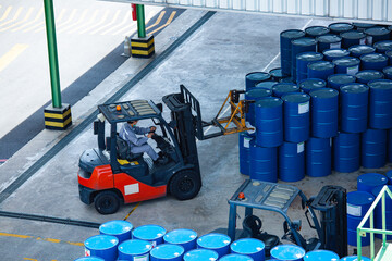 Top view oil barrels forklift truck move for on the transportation worker help