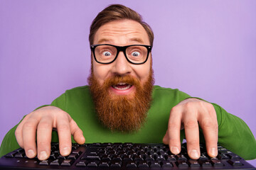 Portrait of young geek nerd in spectacles writing code making new html application isolated on...