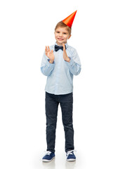 birthday, childhood and people concept - portrait of smiling little boy in party hat and bowtie...