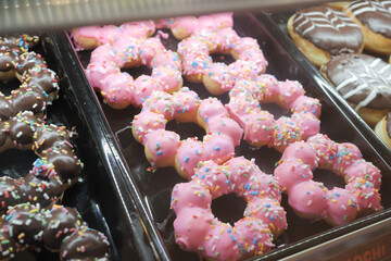 chocolate donuts display for sale at local store 