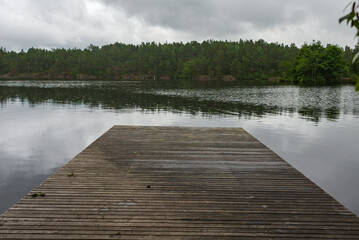 Naklejka premium wooden pier on lake