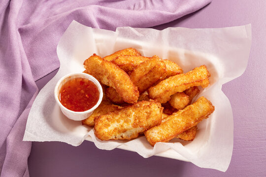 Appetizing gold fried halloumi portion with sweet chilli dip