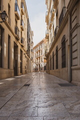Fototapeta na wymiar View of a narrow street in the center of Valencia