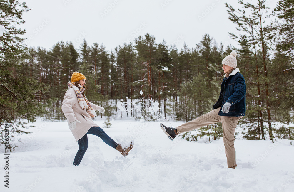 Canvas Prints people, season and leisure concept - happy couple playing with snow in winter park