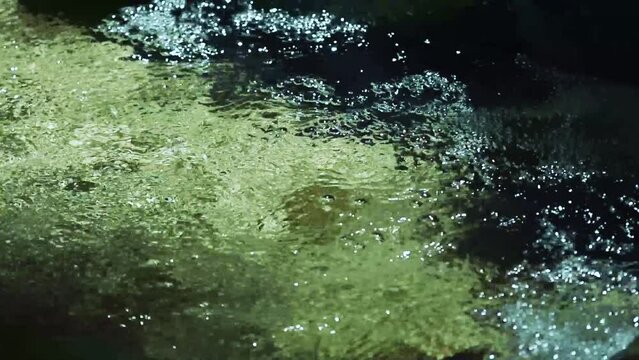 Clear water flowing through a river, close-up 3