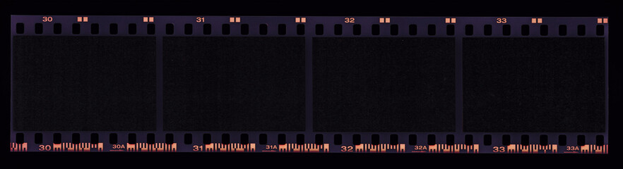 single 35mm film strip with empty frames on black background. dia film material.