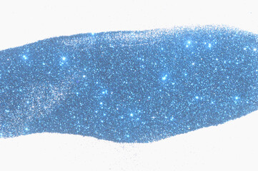 Blue glitter sparkle on light gray background with place for your text