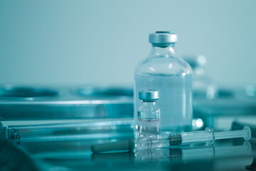 Trial vaccine coronavirus deverlopment vial dose flu shot drug needle syringe,medical concept vaccination hypodermic injection treatment disease care hospital prevention immunization illness disease.