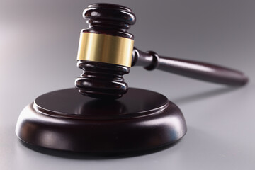 Judicial motolon on gray background. Judgment verdict or auction