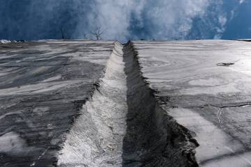 Groove in marble quarry on sunny day.