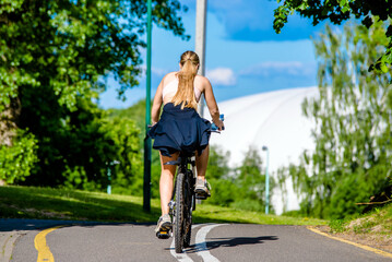 Cyclist ride on the bike path in the city Park
