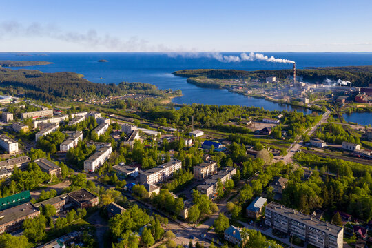 Aerial view of Pitkyaranta town and cellulose factory on sunny summer day. Karelia, Russia.