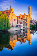 Fototapeta na wymiar Bruges, Belgium. Sunrise on Rozenhoedkaai, old town with Belfry reflection