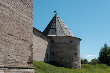 View of tower and wall of Ladoga fortress on sunny summer day. Staraya Ladoga, Leningrad Oblast, Russia.