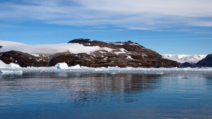 Icebergs floating in front of snow covered mountains at Cierva Cove, Antarctica