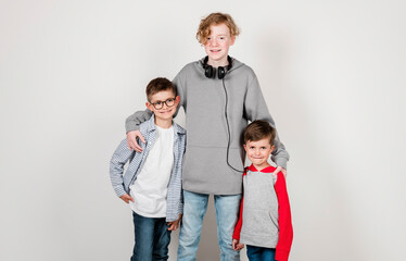 Fototapeta premium portrait of adorable young happy brothers boys on studio white