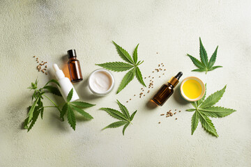 Fototapeta na wymiar Hemp cannabis leaves and beauty products