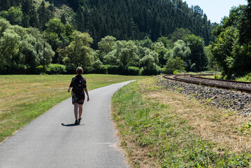  Woman walking along the Railway tracks towards Trier