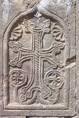 Ancient stone khachkar. Armenian cross