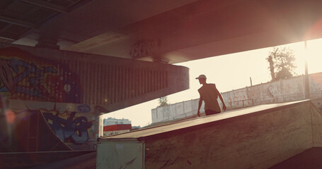 Millennial riders preparing championship together at sunshine city skatepark. 