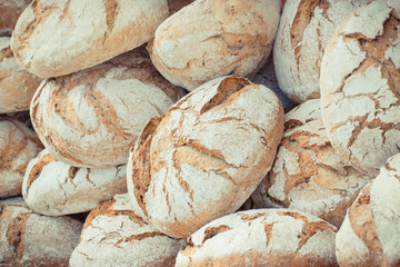 Fresh wholegrain loaves of rye or wheat bread